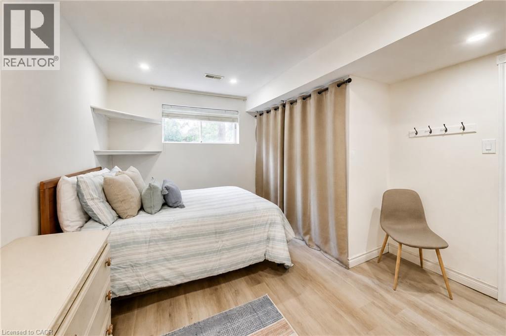 Recessed lighting, wood-finish flooring, built-in wall shelves, and a window for natural light - 35 Shirlea Boulevard, Keswick, ON