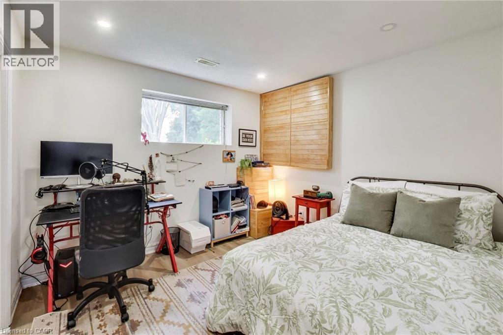 Recessed lighting, window, wood-finish flooring, white walls, built-in shelving - 35 Shirlea Boulevard, Keswick, ON