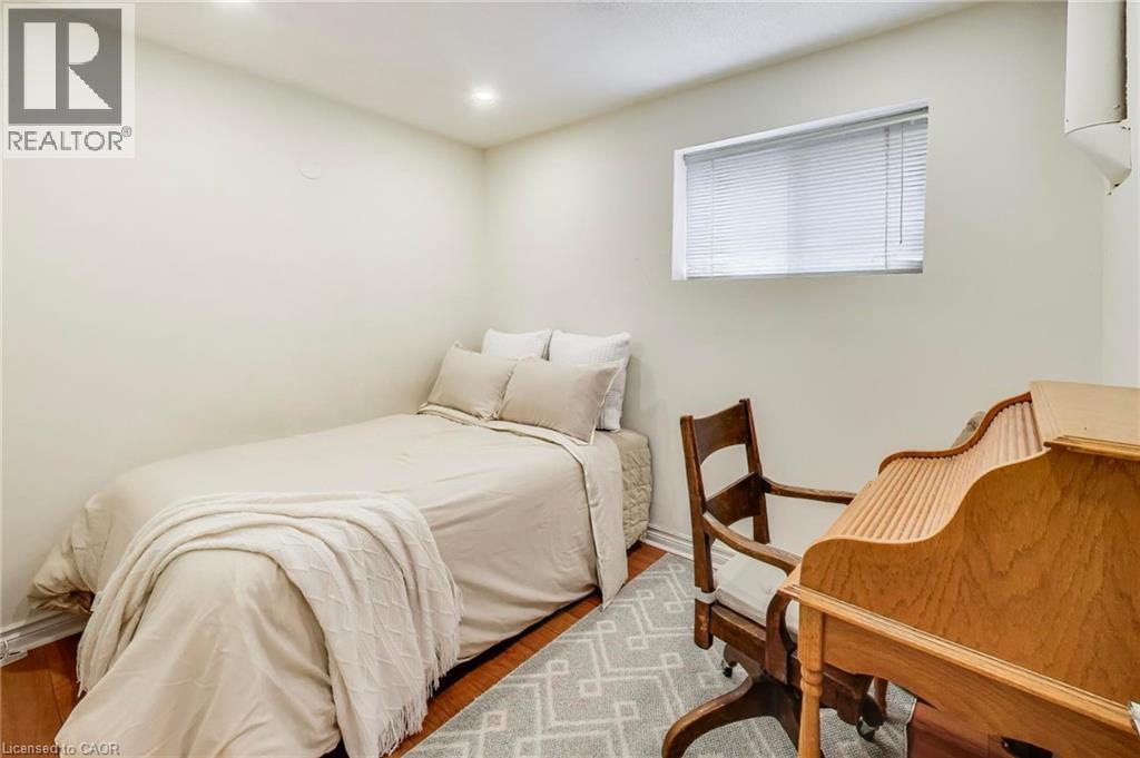Recessed lighting, wood-finish flooring, and a single window with blinds - 35 Shirlea Boulevard, Keswick, ON