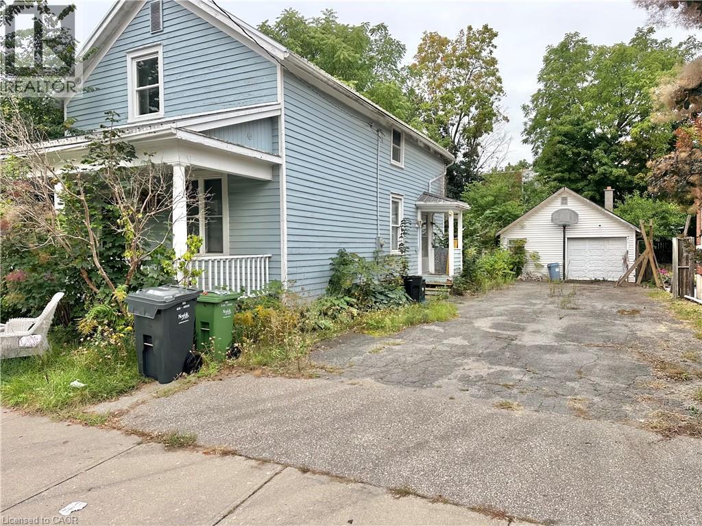 side of the Home - driveway and garage - 128 Kent Street S, Simcoe, ON
