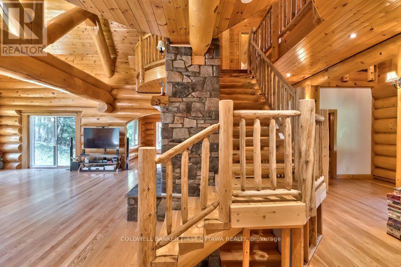Log staircase to second floor - 2467 Darling Road, Lanark Highlands, ON