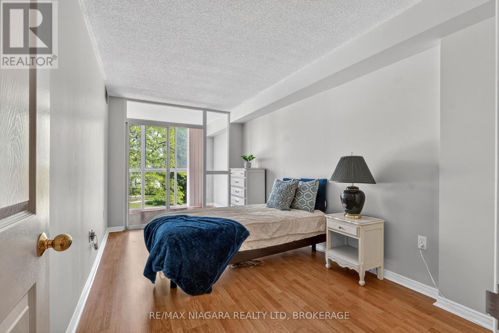 Bedroom 2 with access to Sunroom - 204 - 162 Martindale Road, St. Catharines (Grapeview), ON