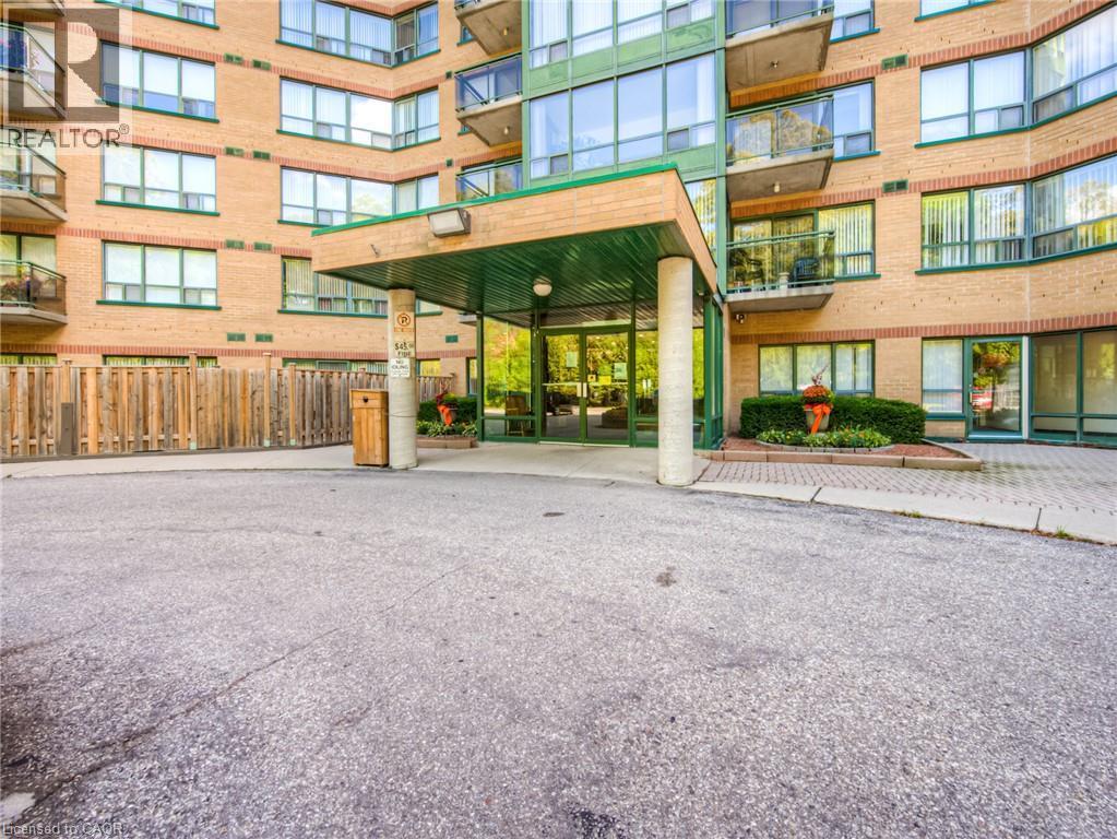 Brick exterior with multiple balconies - 237 King Street W Unit# 102, Cambridge, ON