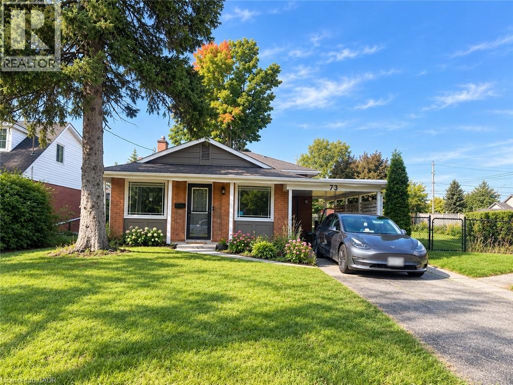 Brick and siding exterior with a single-car carport - 73 Larkspur Crescent, Kitchener, ON