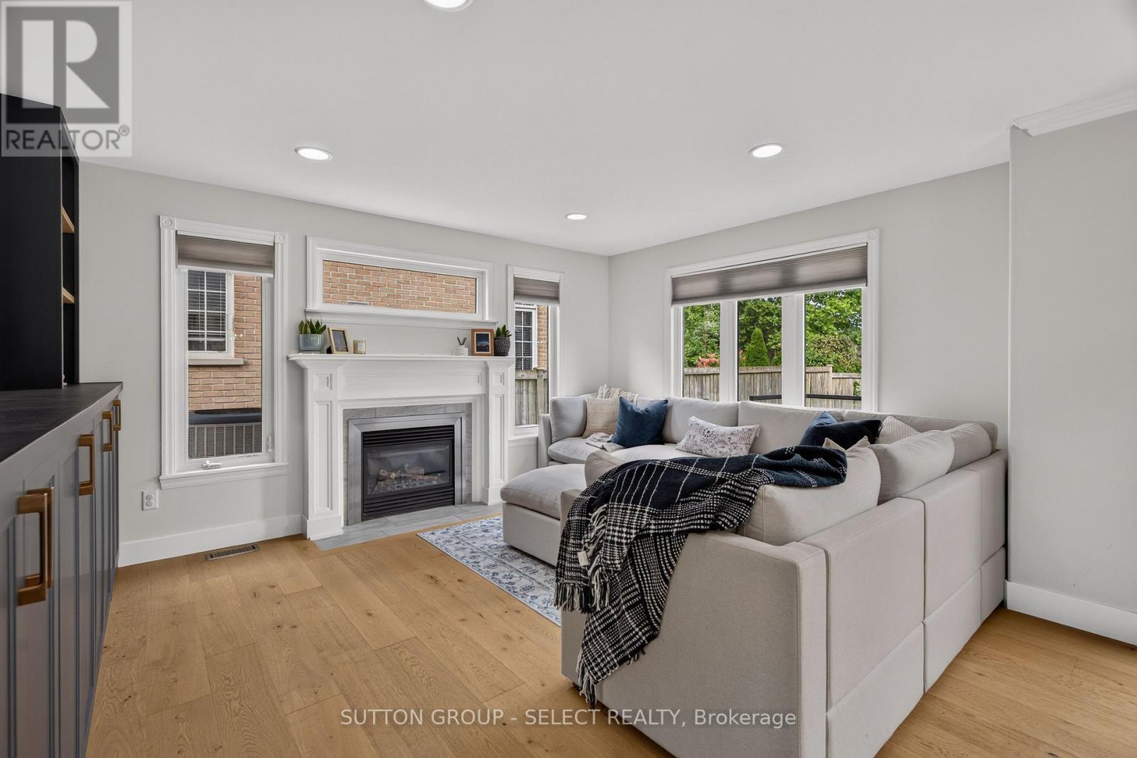 Living room with large bright windows - 121 Tanoak Drive, London North (North E), ON