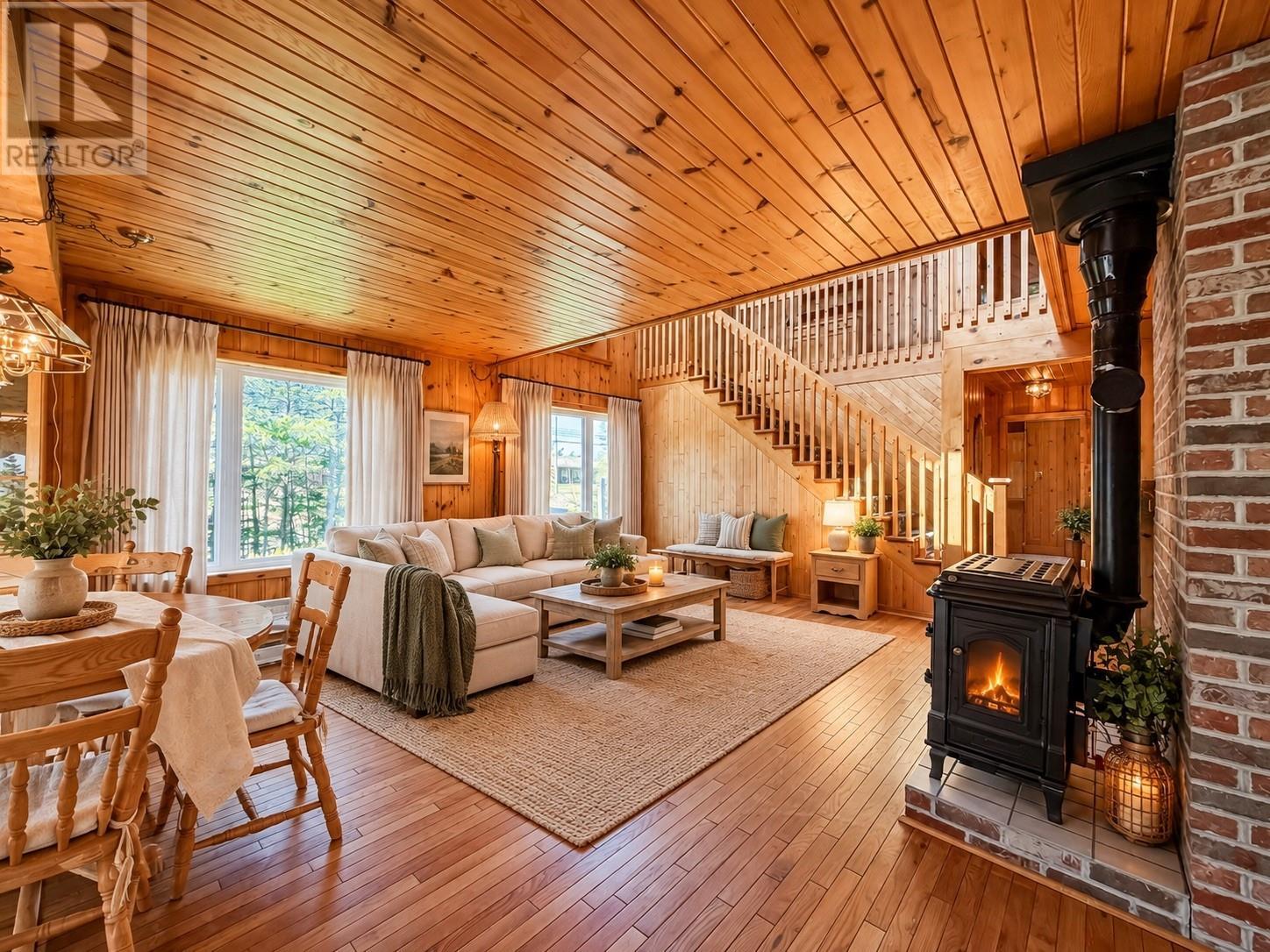 Living & dining room staged using A.I. - 157 Kimberley Farm Drive, Winterland, NL