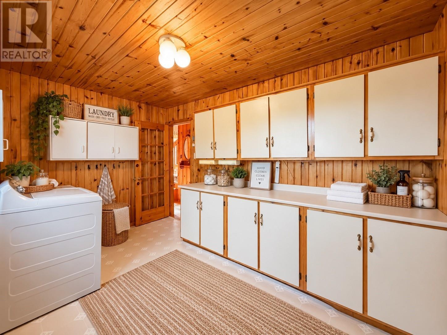Laundry room staged with A.I. - 157 Kimberley Farm Drive, Winterland, NL