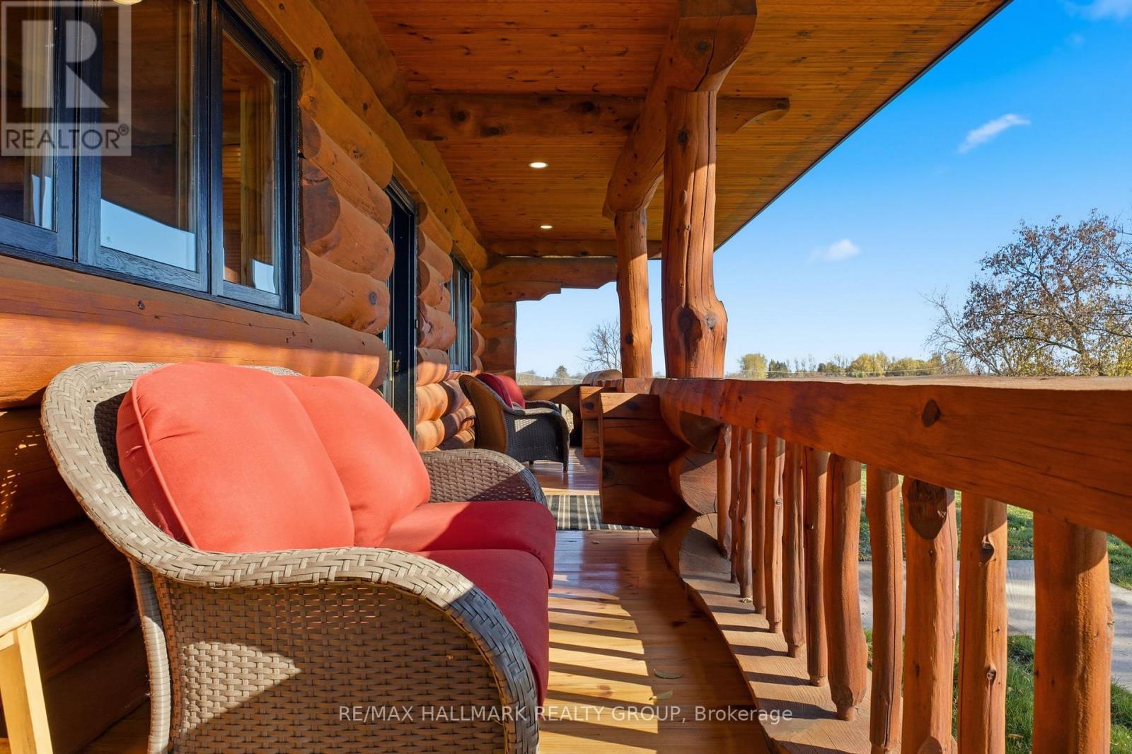Covered porch overlooking grounds - 11709 County 38 Road, North Dundas, ON