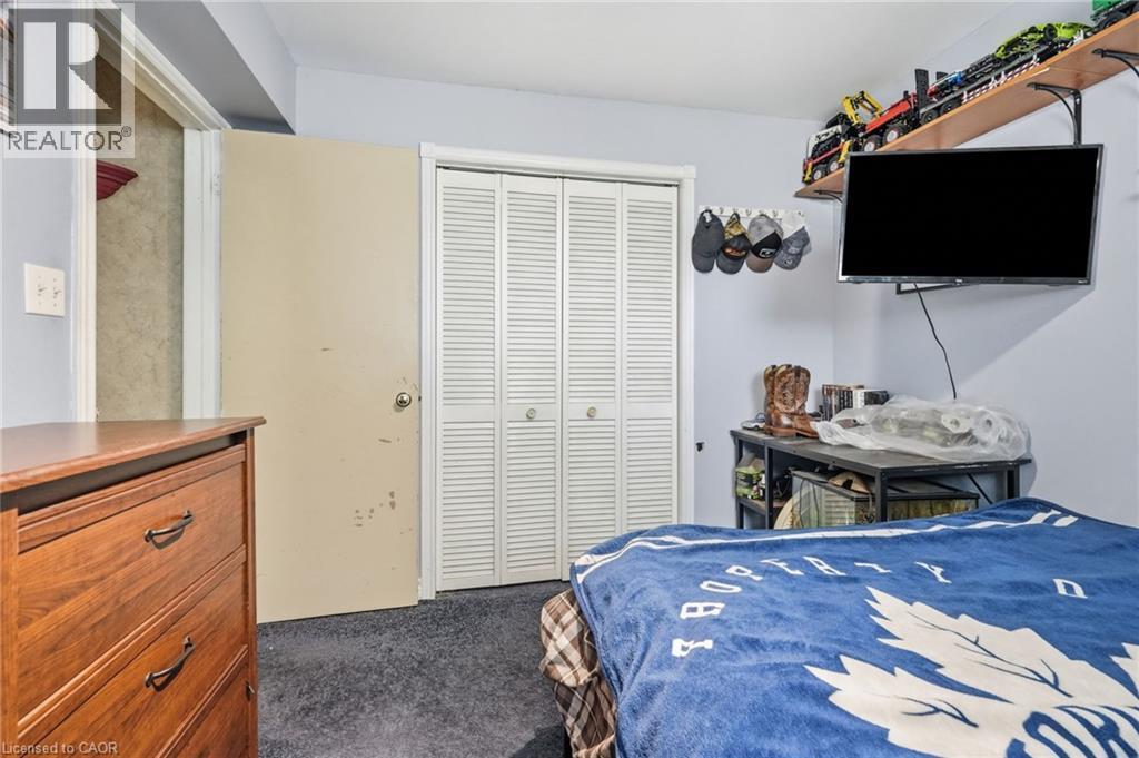 White louvered bi-fold closet doors - 1311 W Concession 6 Road, Flamborough, ON