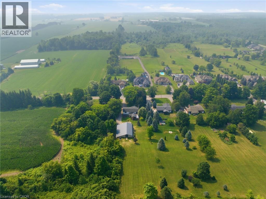 Expansive green acreage featuring mature trees and cultivated fields - 1311 W Concession 6 Road, Flamborough, ON