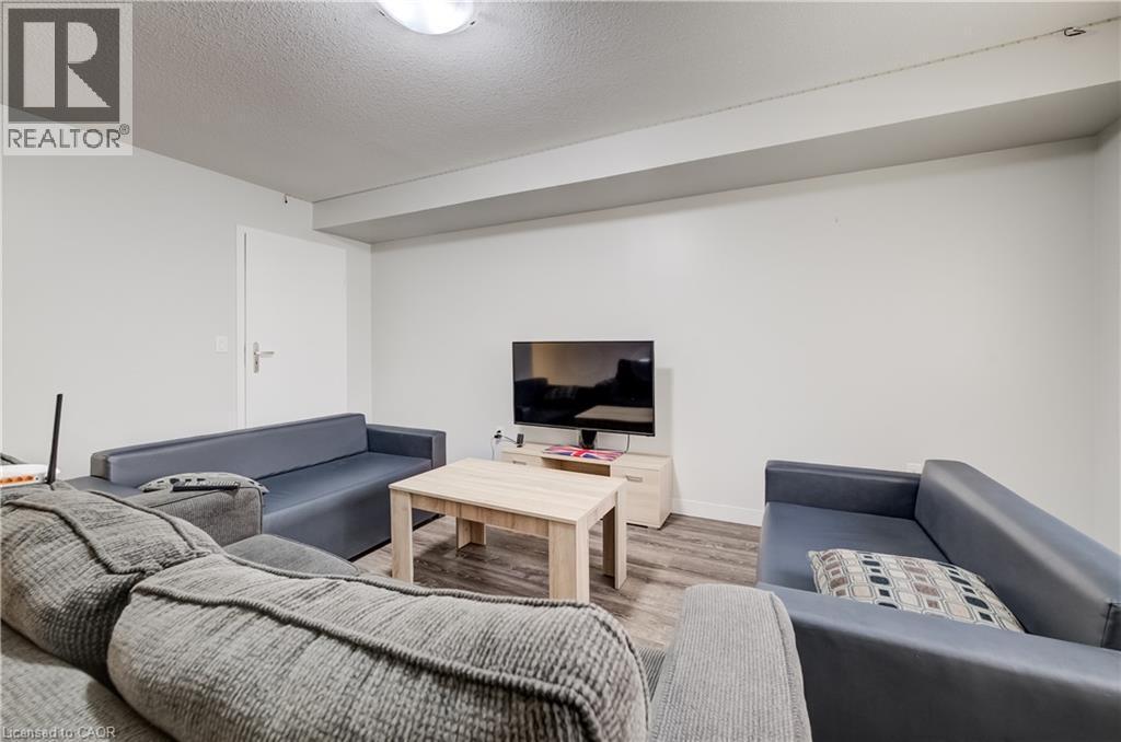 Hardwood-style flooring in a multi-tone finish - 338 Albert Street Unit# 114, Waterloo, ON