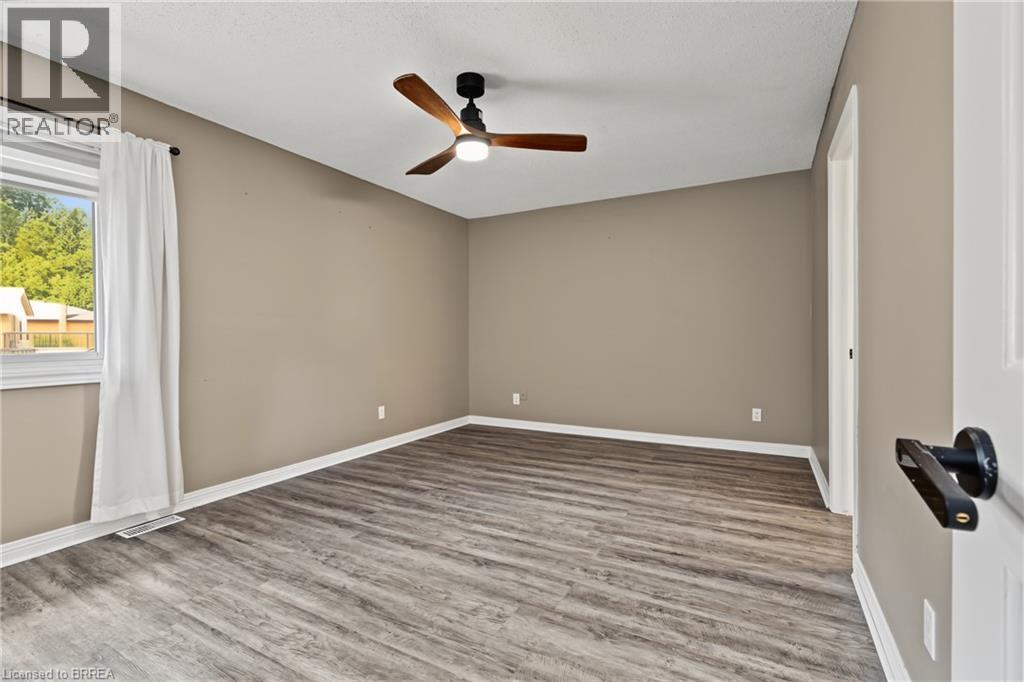 Wood-finish flooring with a neutral wall palette - 141 Race Street, Paris, ON