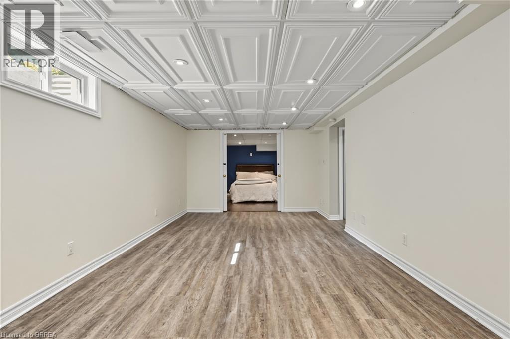 Wood-finish flooring, recessed lighting, and a white paneled ceiling - 141 Race Street, Paris, ON