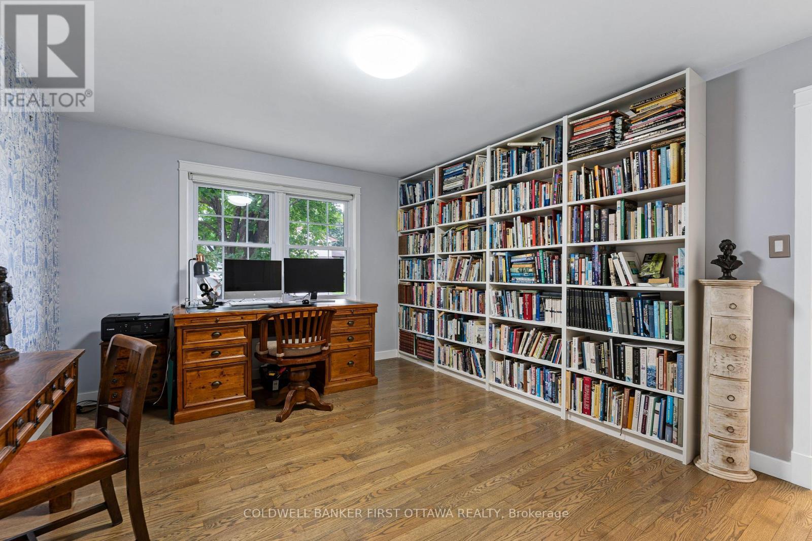 Main floor bedroom used as office has b/i bookshel - 25 Robert Road, Perth, ON