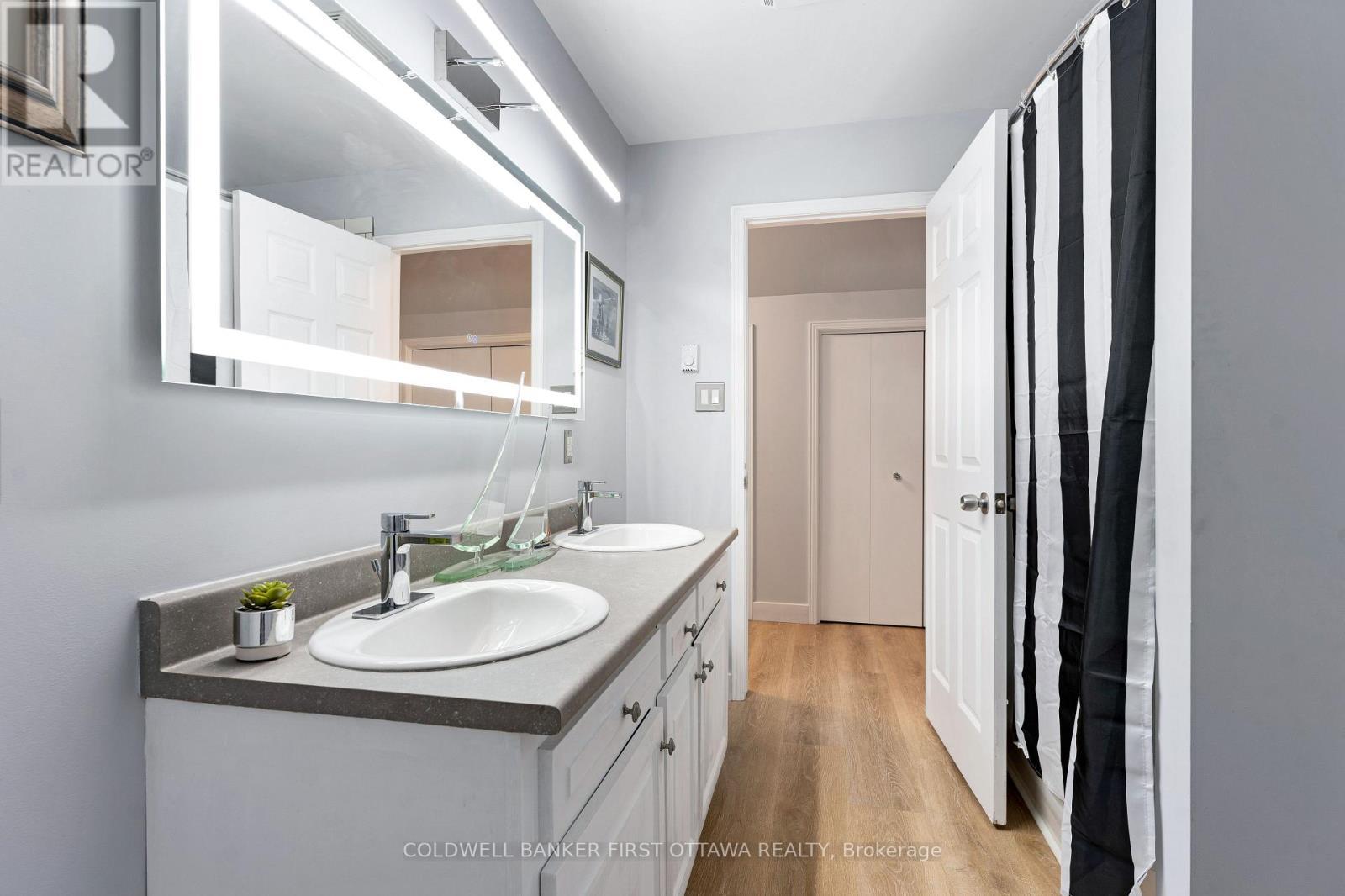 Second floor bathroom with double sink vanity - 25 Robert Road, Perth, ON