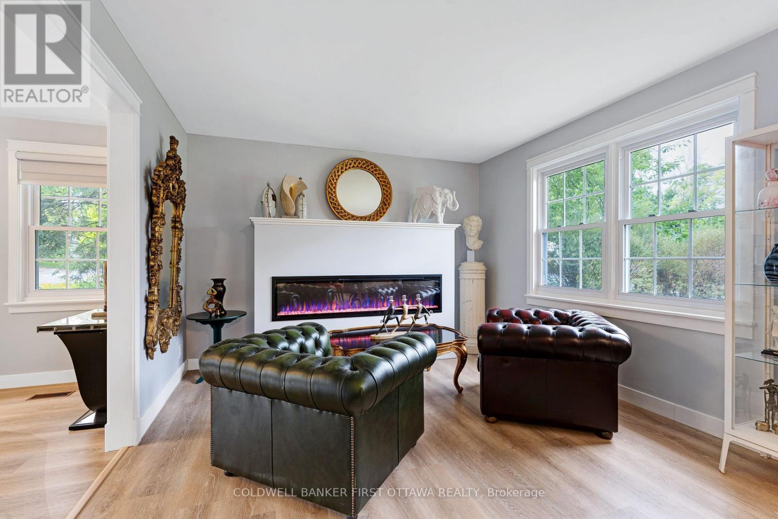 Cozy sitting space with electric fireplace - 25 Robert Road, Perth, ON