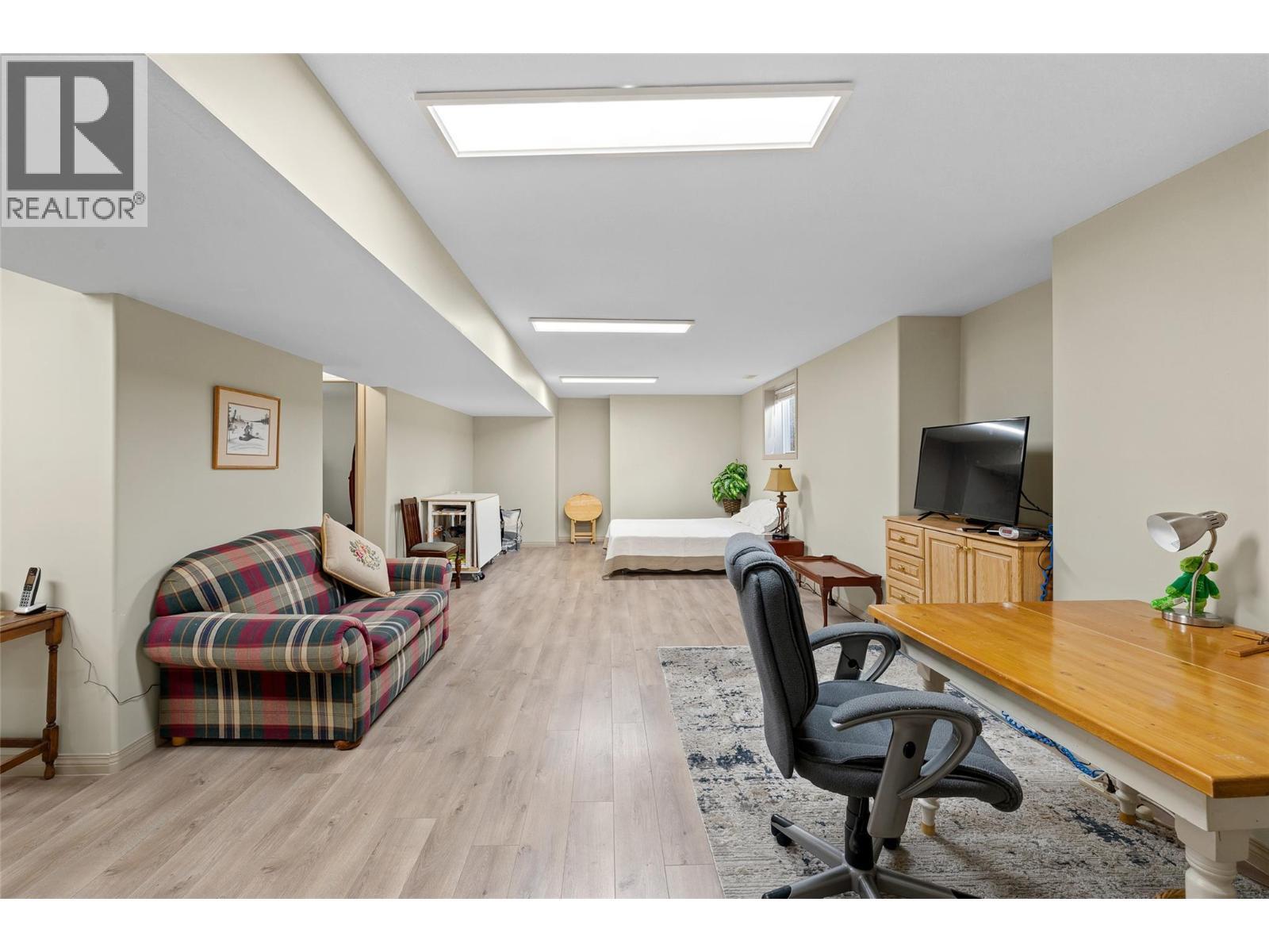 Expansive lower-level family room offering flexible living space. - 1188 Houghton Road Unit# 122, Kelowna, BC