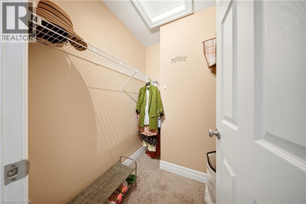 Neutral-toned walls complement the light-colored carpeting - 167 Broadoaks Drive, Cambridge, ON