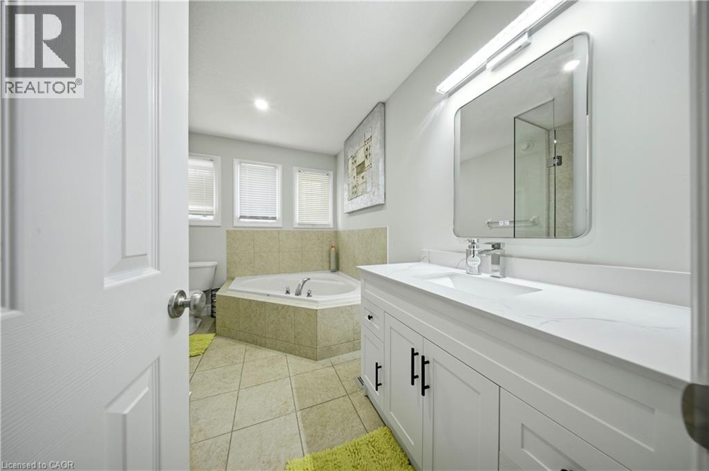 White shaker vanity with a white countertop and rectangular undermount sink - 167 Broadoaks Drive, Cambridge, ON