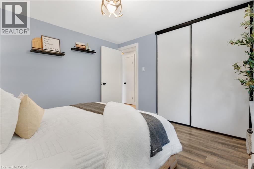 Wood-finish flooring with a light-toned wall color - 477 Kingscourt Drive Unit# B, Waterloo, ON