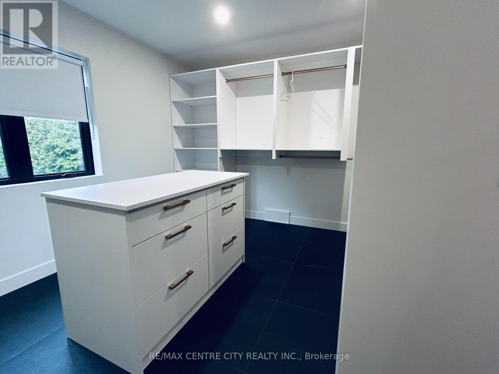 Primary Bedroom walk-in closet with natural light - 53900 Heritage Line, Bayham (Richmond), ON