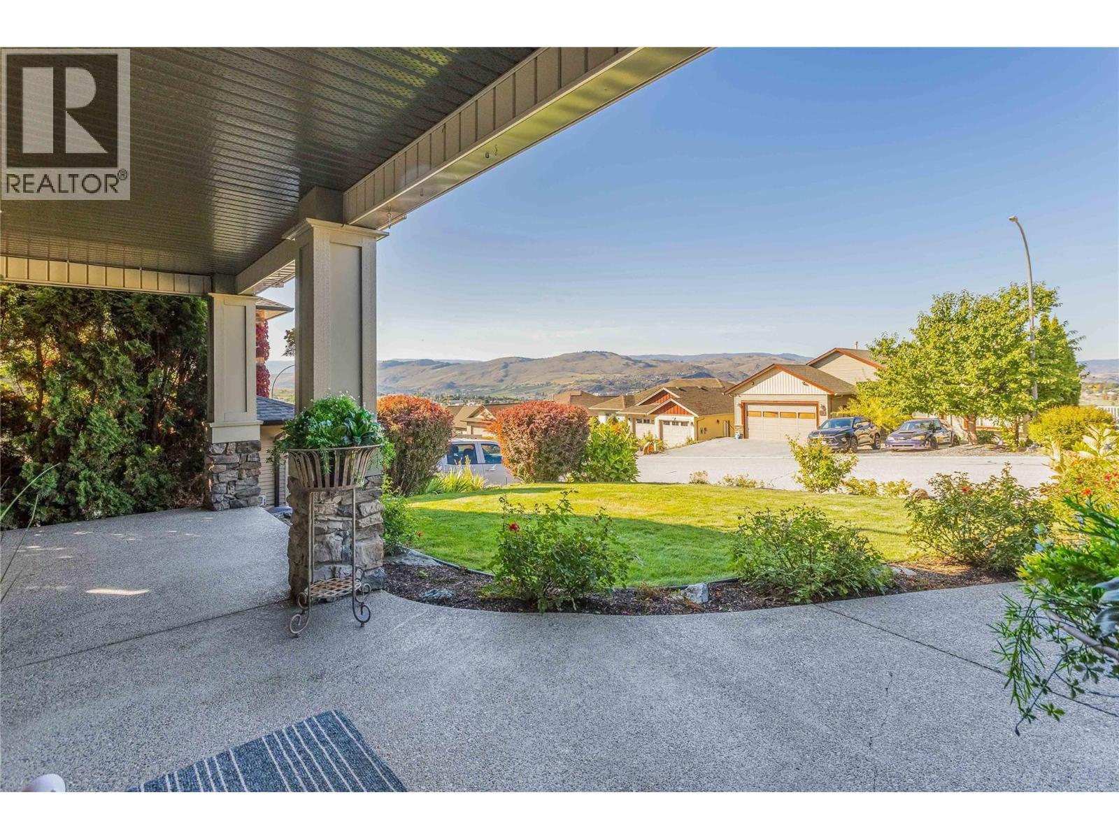 spacious and inviting front patio ~ so many lounging areas! - 1113 Mt Fosthall Drive, Vernon, BC