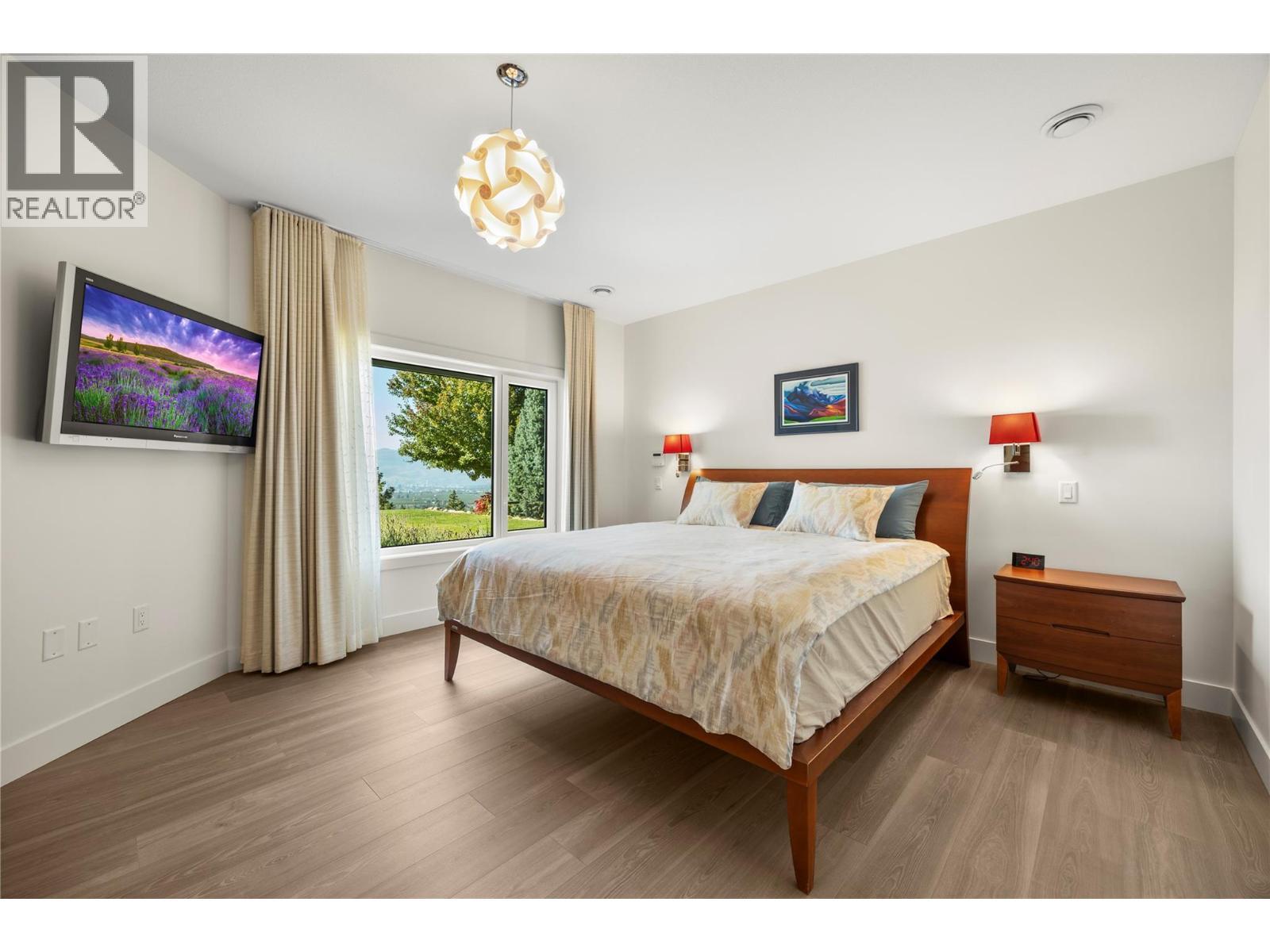 Lower level Primary bedroom with lake views - 2442 Bella Vista Street, Kelowna, BC