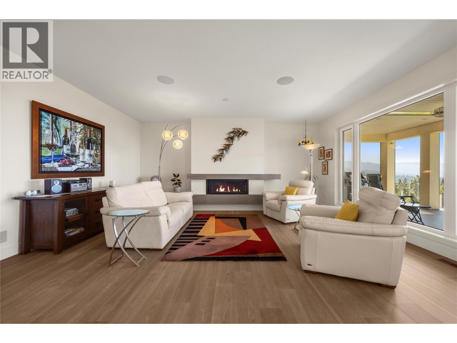 Featuring a linear gas fireplace - 2442 Bella Vista Street, Kelowna, BC