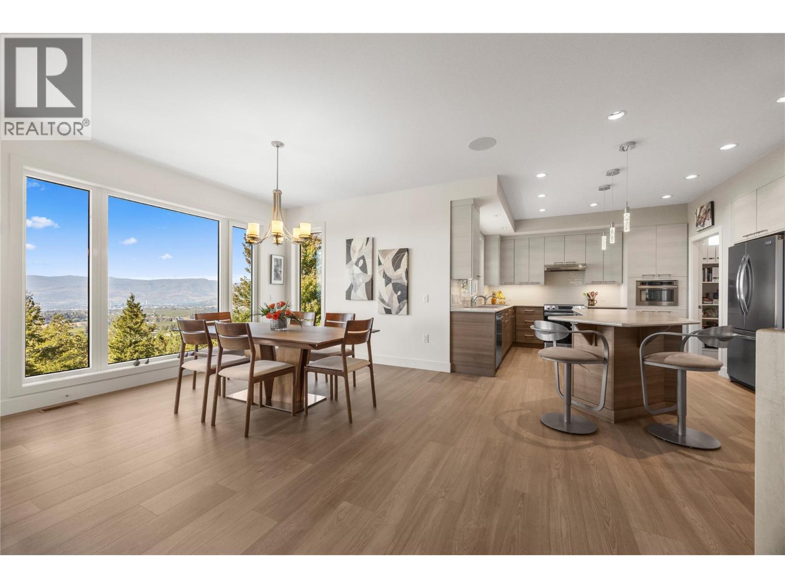 Living room opens up to the dining room and kitchen - 2442 Bella Vista Street, Kelowna, BC