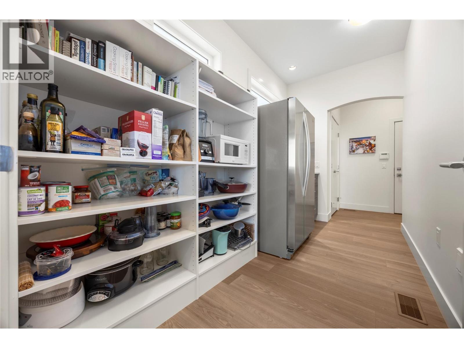 Walk through pantry with built in shelves and second fridge - 2442 Bella Vista Street, Kelowna, BC