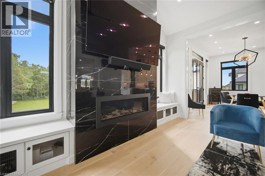 Black marbled fireplace with an integrated linear firebox - 56 Augustus Street, Scotland, ON