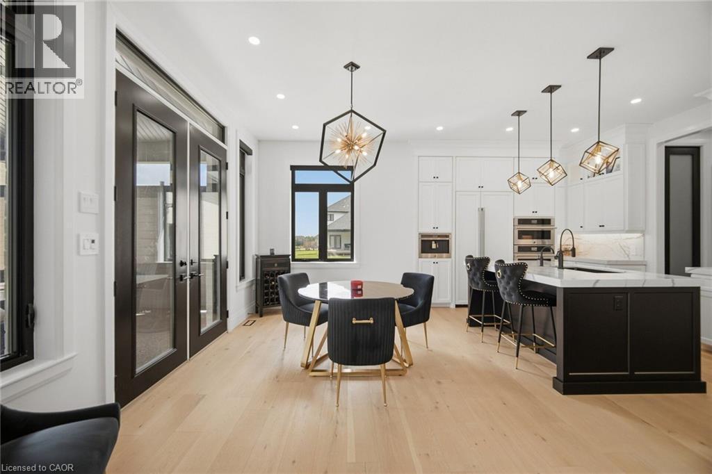 Light wood-finish flooring with recessed lighting - 56 Augustus Street, Scotland, ON