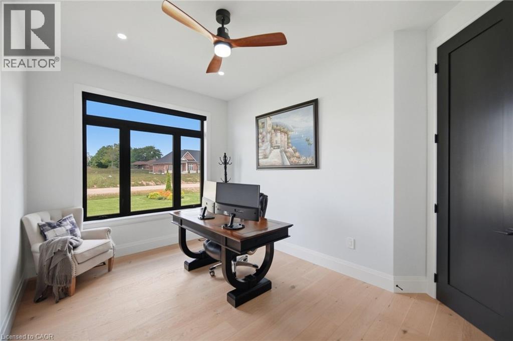 Recessed lighting, wood-finish flooring, ceiling fan, and a large window with black trim - 56 Augustus Street, Scotland, ON