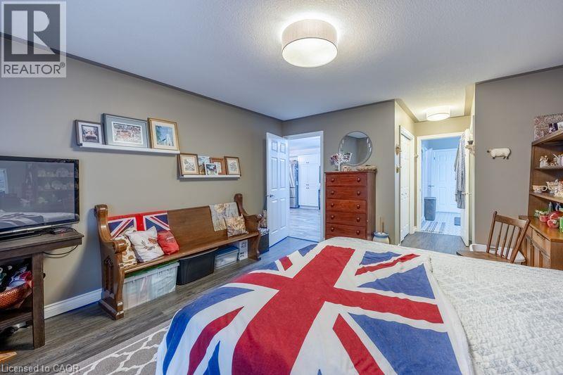 Wood-finish flooring throughout, complemented by neutral wall tones - 123 Mill Street, Delhi, ON