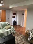 Interior space featuring wood-finish flooring and two sets of interior paneled doors -
