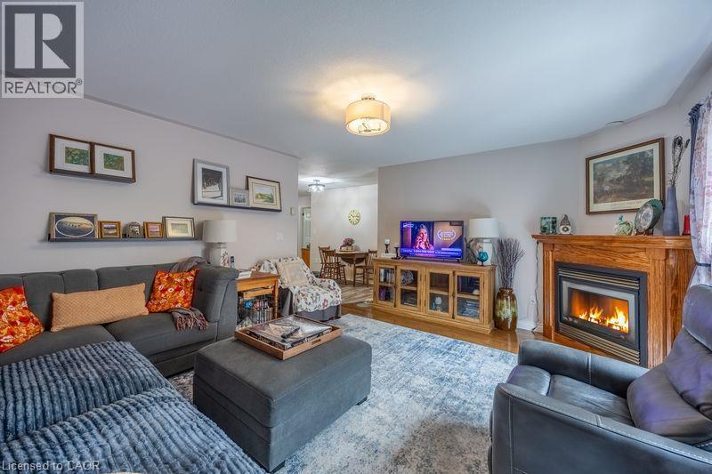Recessed fireplace with wood-finish surround - 123 Mill Street, Delhi, ON