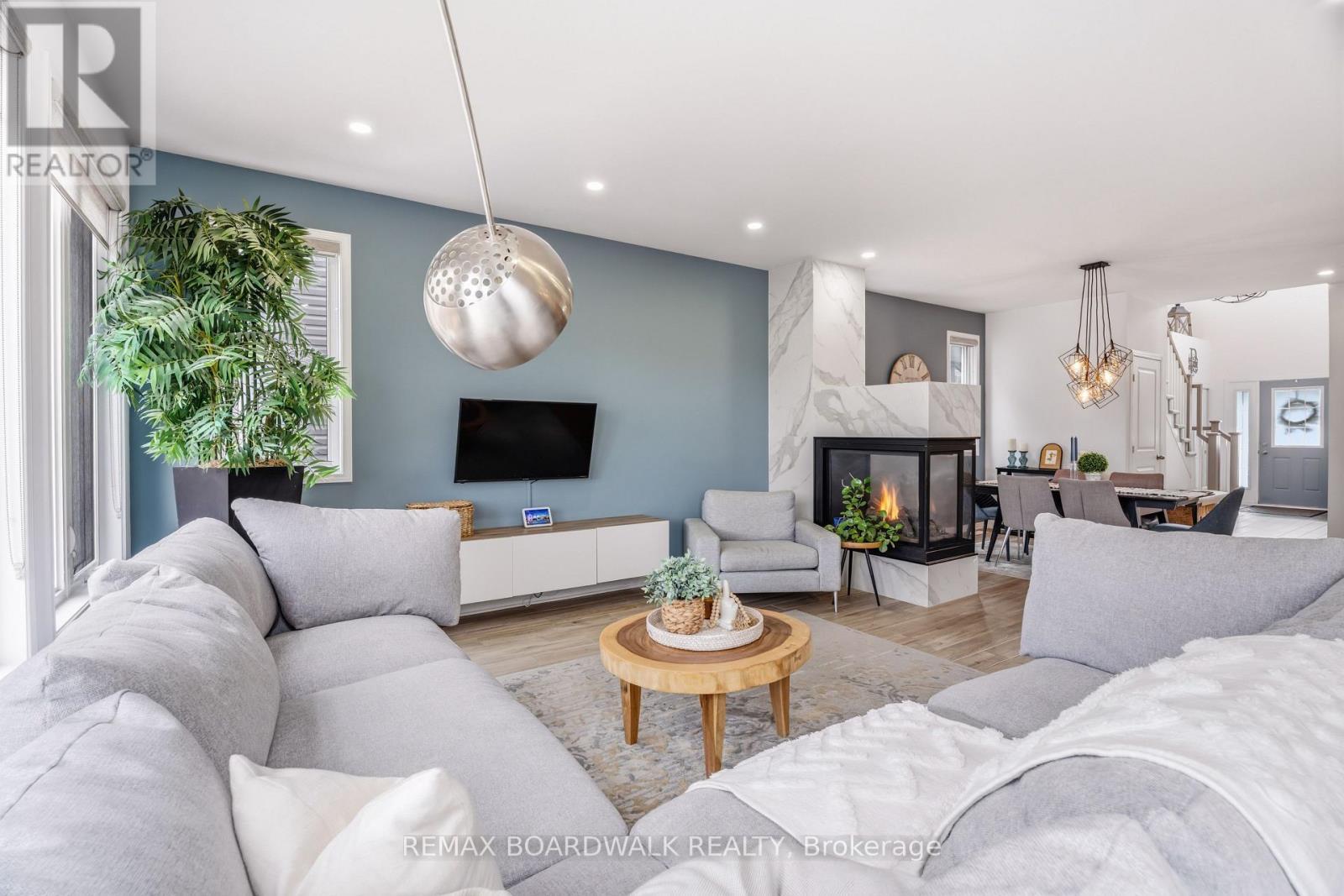 Open sightlines connect the main living spaces - 210 Pingwi Place, Ottawa, ON
