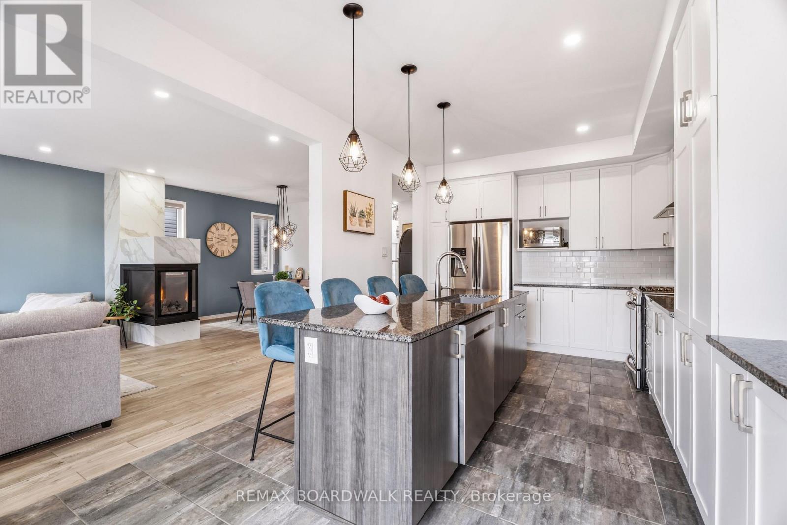 Large island anchors this upgraded kitchen - 210 Pingwi Place, Ottawa, ON