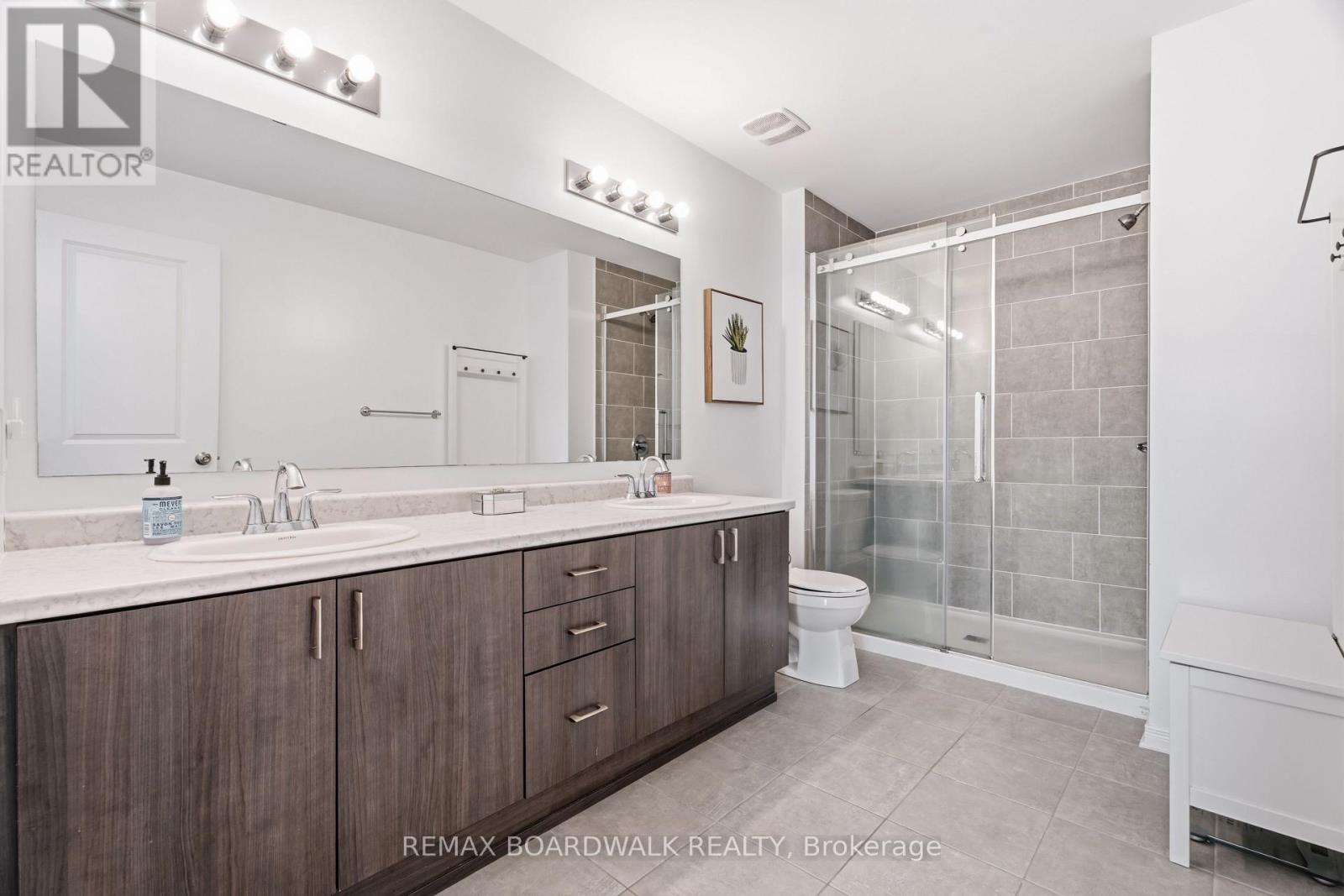 Redesigned ensuite with oversized glass shower - 210 Pingwi Place, Ottawa, ON
