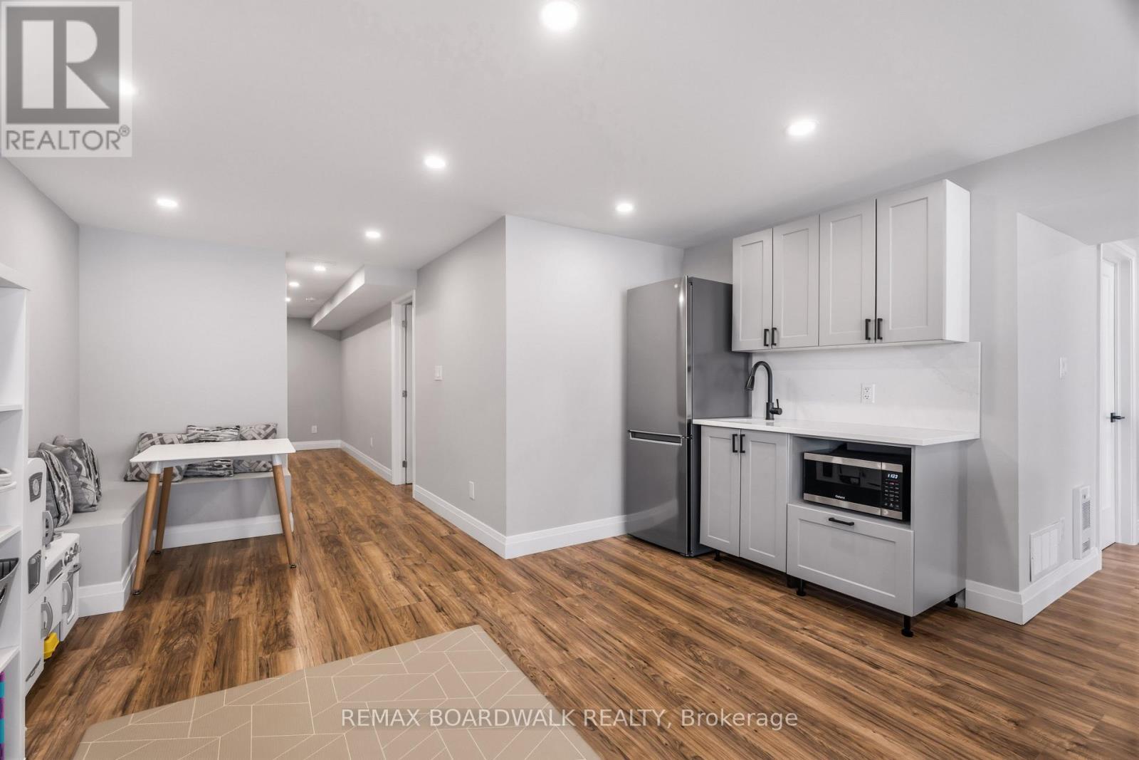 Kitchenette with quartz counters & cabinetry - 210 Pingwi Place, Ottawa, ON