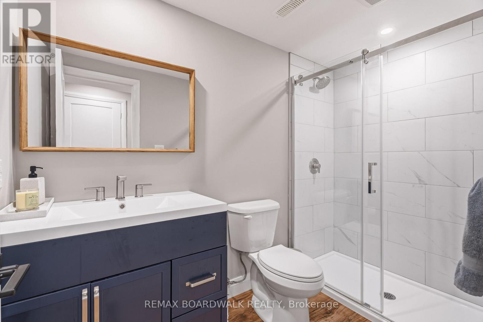 Lower-level 3-piece bath with glass shower - 210 Pingwi Place, Ottawa, ON