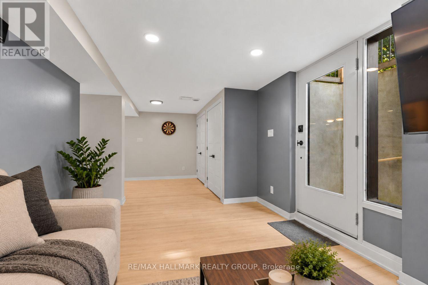 Lower-level secondary unit living and entry area - 5 Rayburn Street, Ottawa, ON