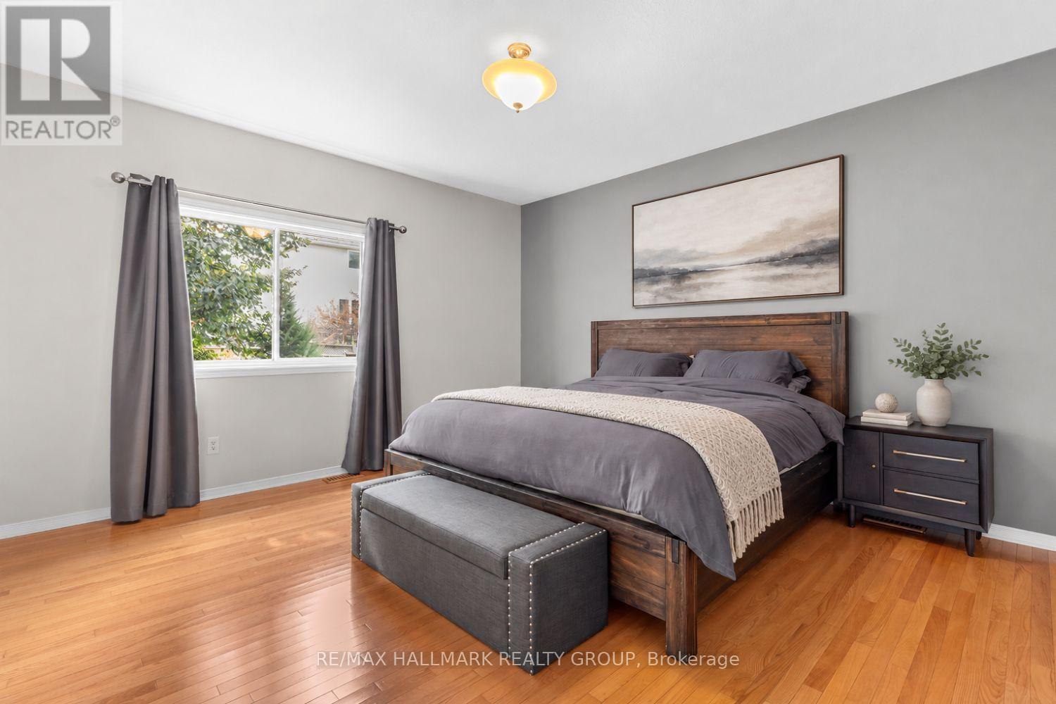 Primary bedroom with hardwood floors - 5 Rayburn Street, Ottawa, ON