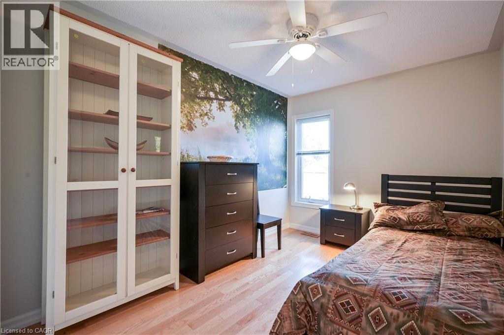 Hardwood-finish flooring throughout the room - 12 Langevin Drive, Wasaga Beach, ON