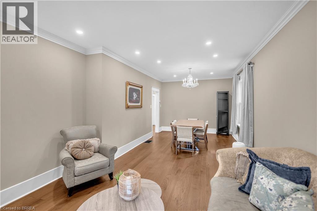 Hardwood flooring throughout, recessed lighting, crown molding, and a chandelier fixture - 11 Tutela Heights Road, Brantford, ON
