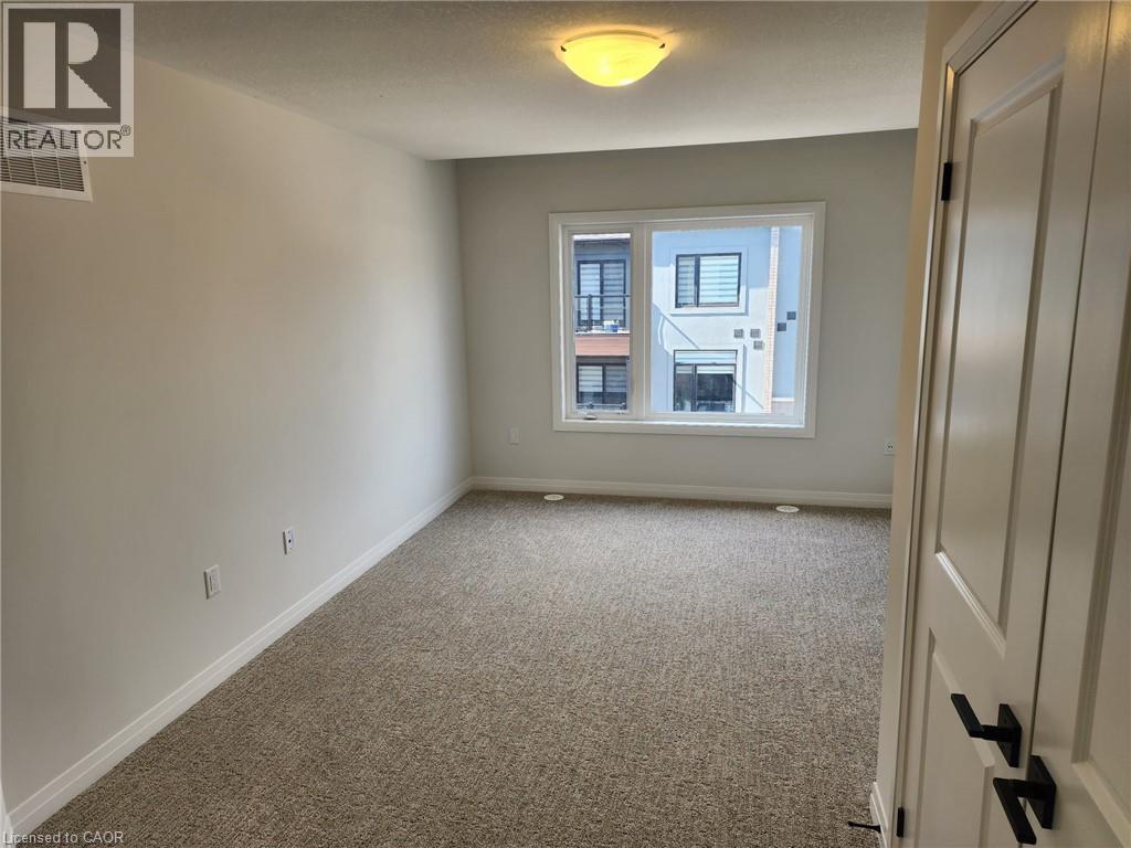 Neutral paint palette with wall-to-wall carpeting - 155 Equestrian Way Unit# 152, Cambridge, ON
