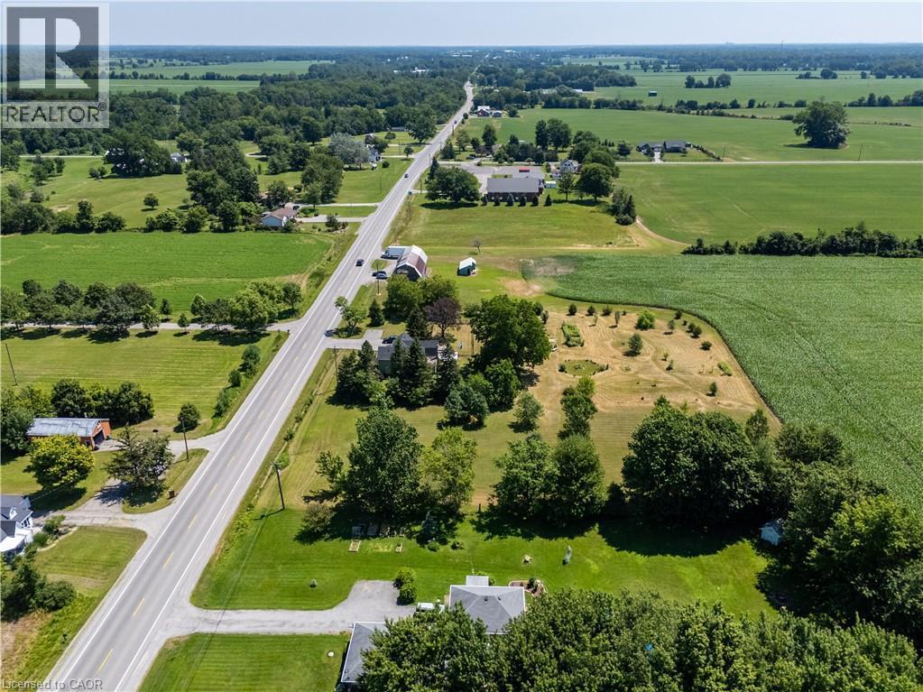 Expansive aerial perspective showcasing a rural landscape with significant acreage - 42841 Highway 3, Wainfleet, ON