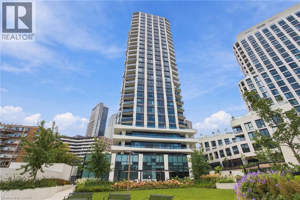 Modern high-rise residential building with multiple balconies, expansive windows, and a ground-level amenity space - 60 Central Park Roadway Unit# 2010, Etobicoke, ON