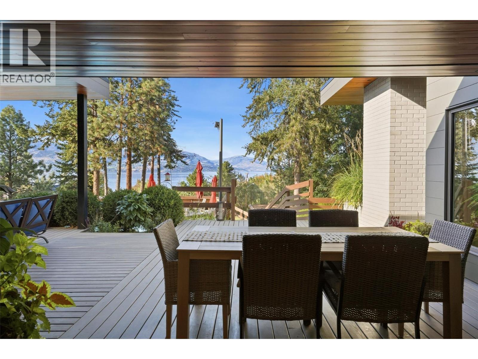 Walk out from Dining room to covered eating area - 5147 Lakeshore Road, Kelowna, BC