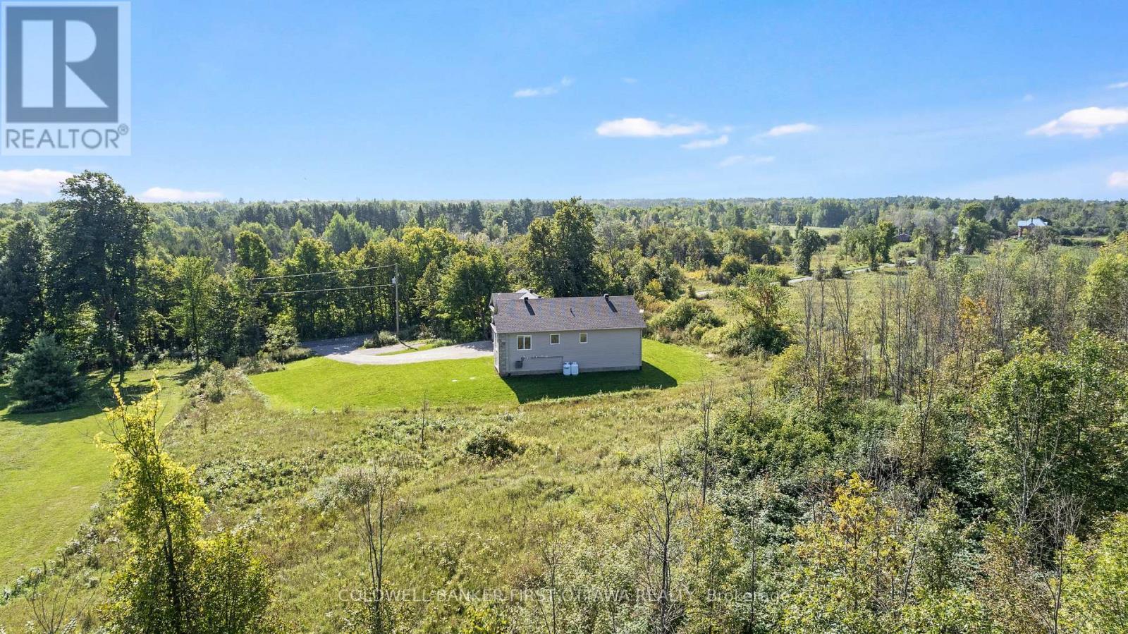 Big yard for gardens & play. Backing on woodlands - 268 Boyds Road, Lanark Highlands, ON